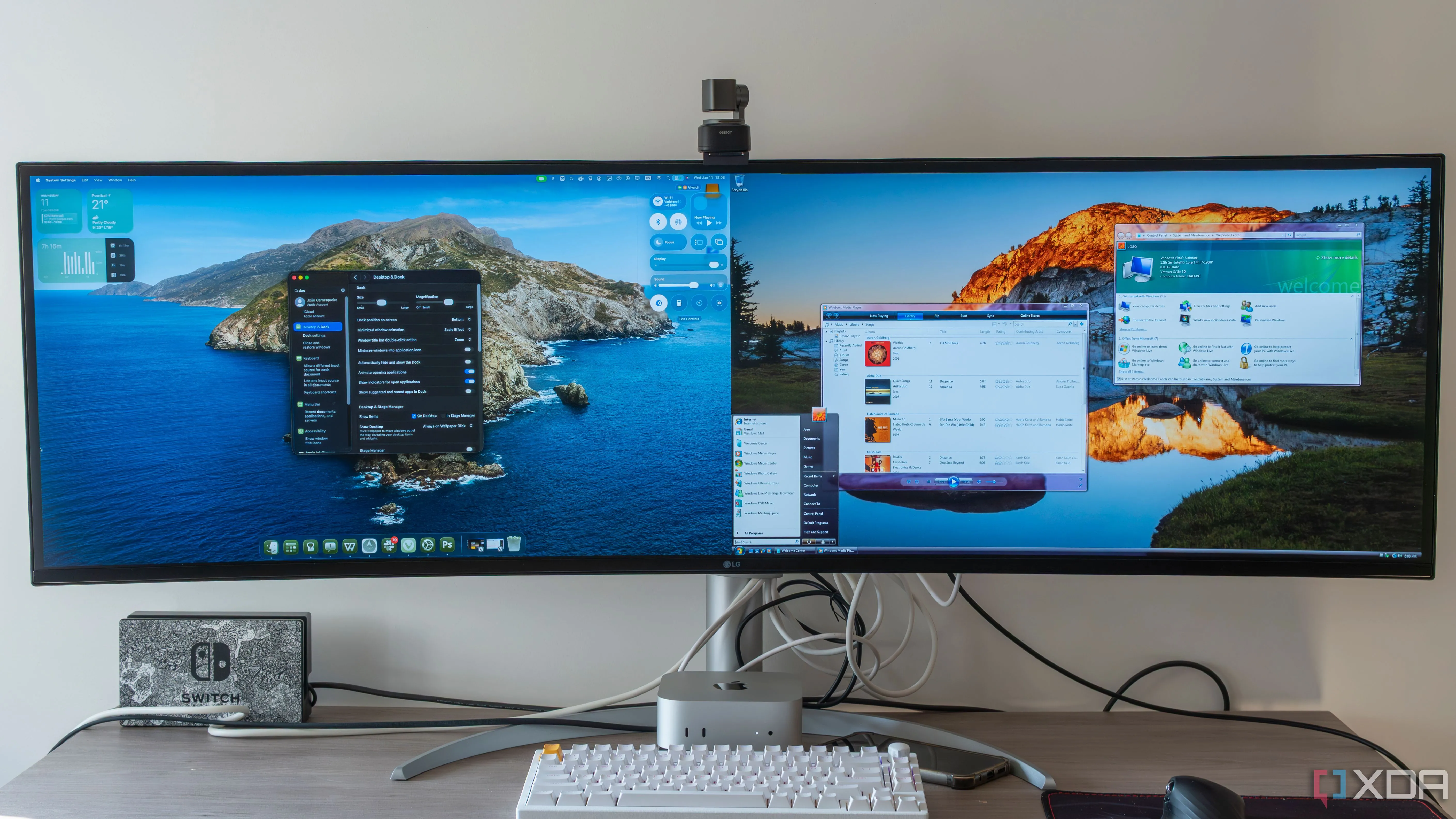 An ultrawide monitor displaying macOS 26 Tahoe and Windows Vista side by side