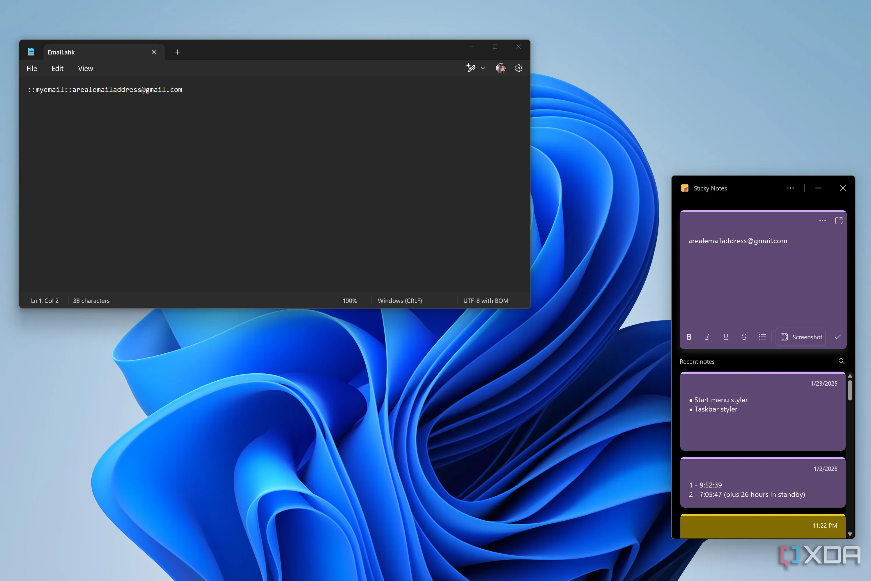 Ảnh chụp màn hình máy tính Windows 11 hiển thị một script AutoHotKey để tự động hóa việc nhập văn bản lặp lại như địa chỉ email