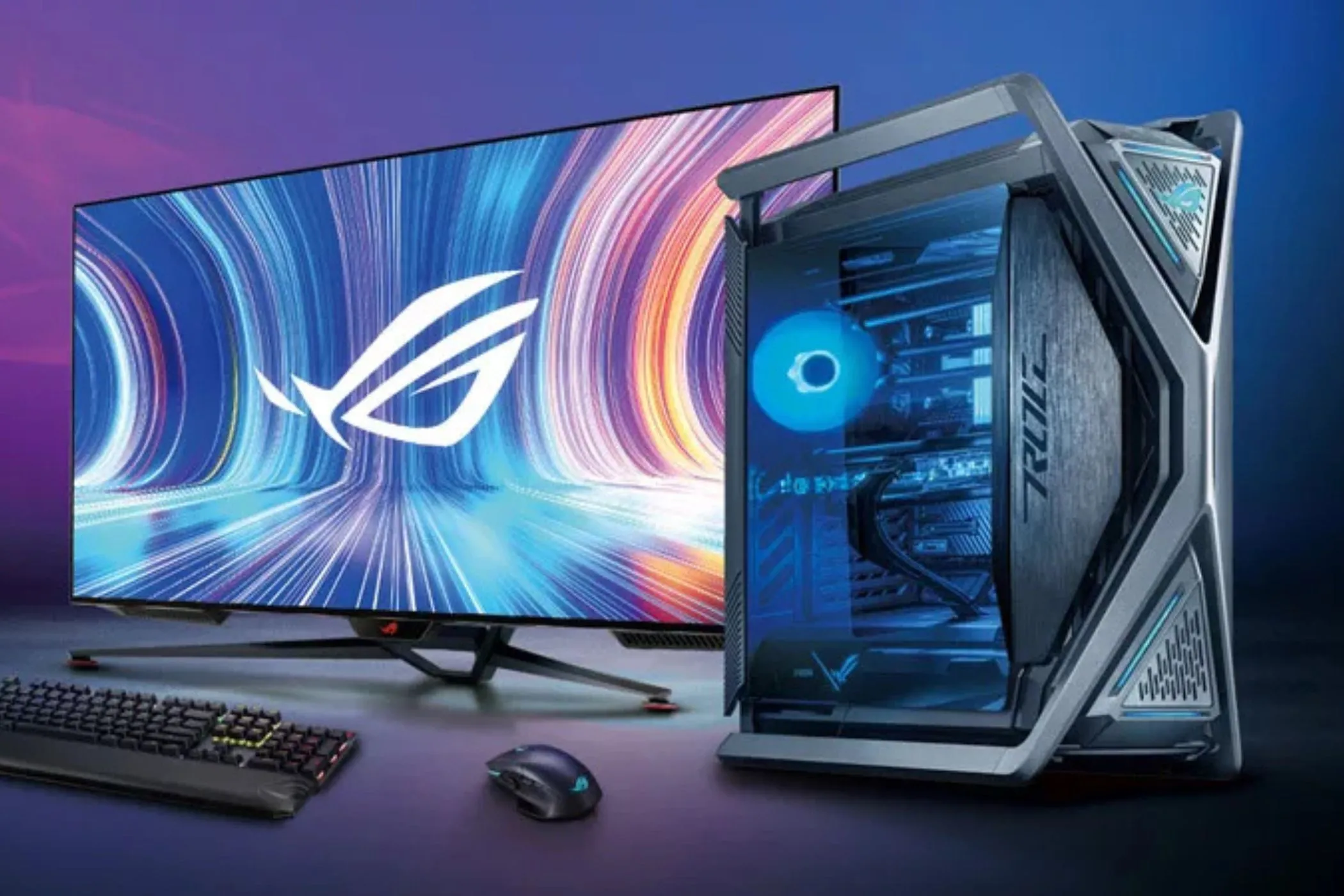 Bàn làm việc với bộ PC gaming mạnh mẽ, màn hình và bàn phím, thể hiện sự đầu tư lớn vào trải nghiệm chơi game trên PC