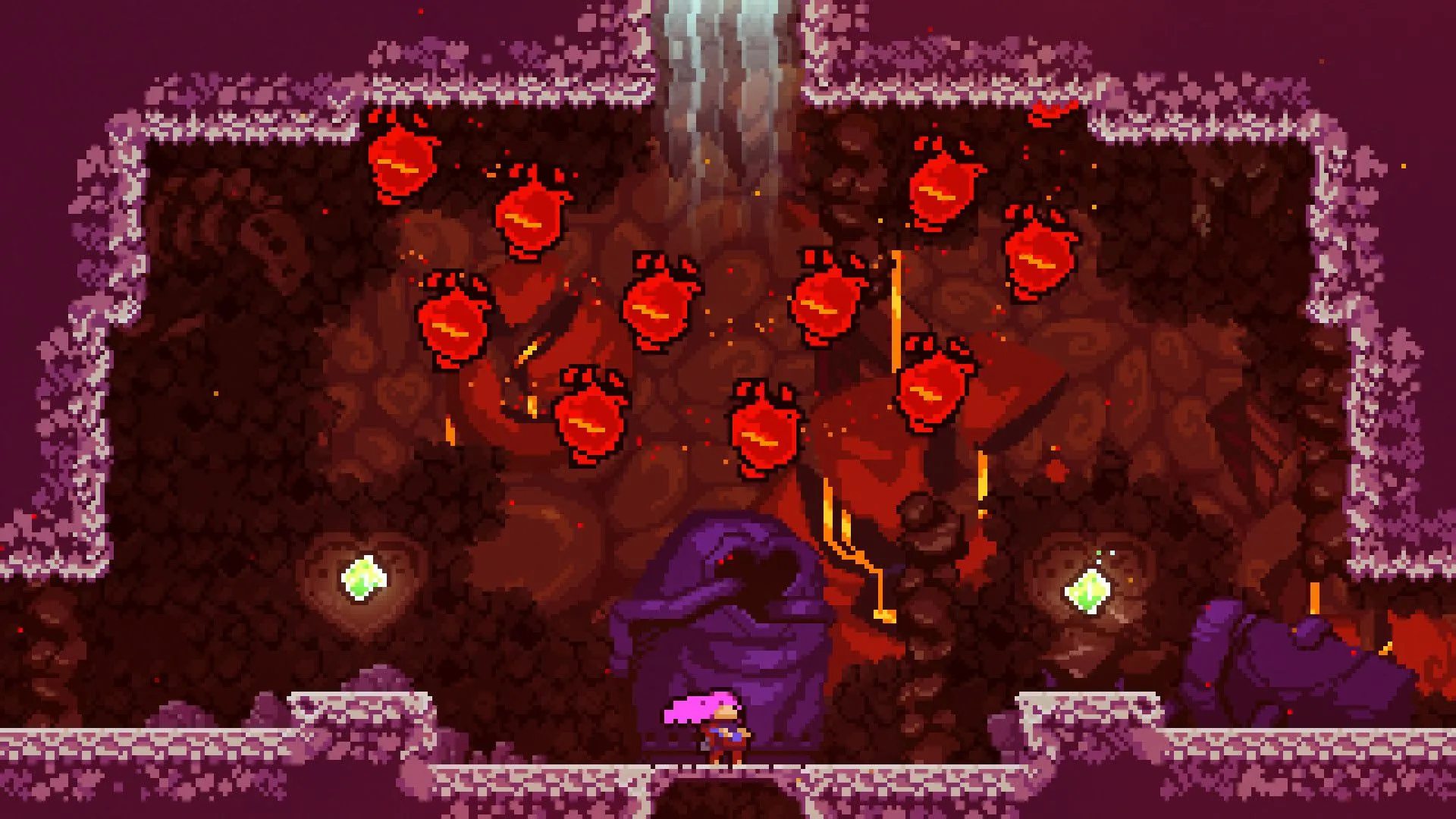 Các quả cầu đỏ rơi xuống nhân vật chính trong Celeste, thể hiện một thử thách trong game.