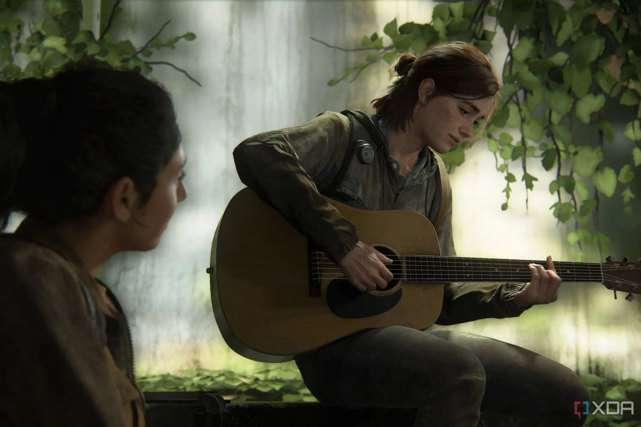 Ellie ngồi chơi guitar trong một khoảnh khắc yên bình từ The Last of Us Part II, thể hiện chiều sâu cảm xúc của nhân vật.