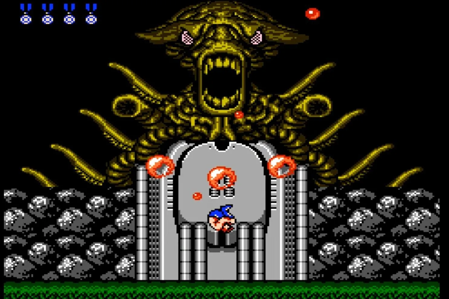 Hình ảnh trận chiến với trùm ngoài hành tinh trong Contra trên NES, một game run-and-gun với độ khó cao nếu không dùng Konami Code