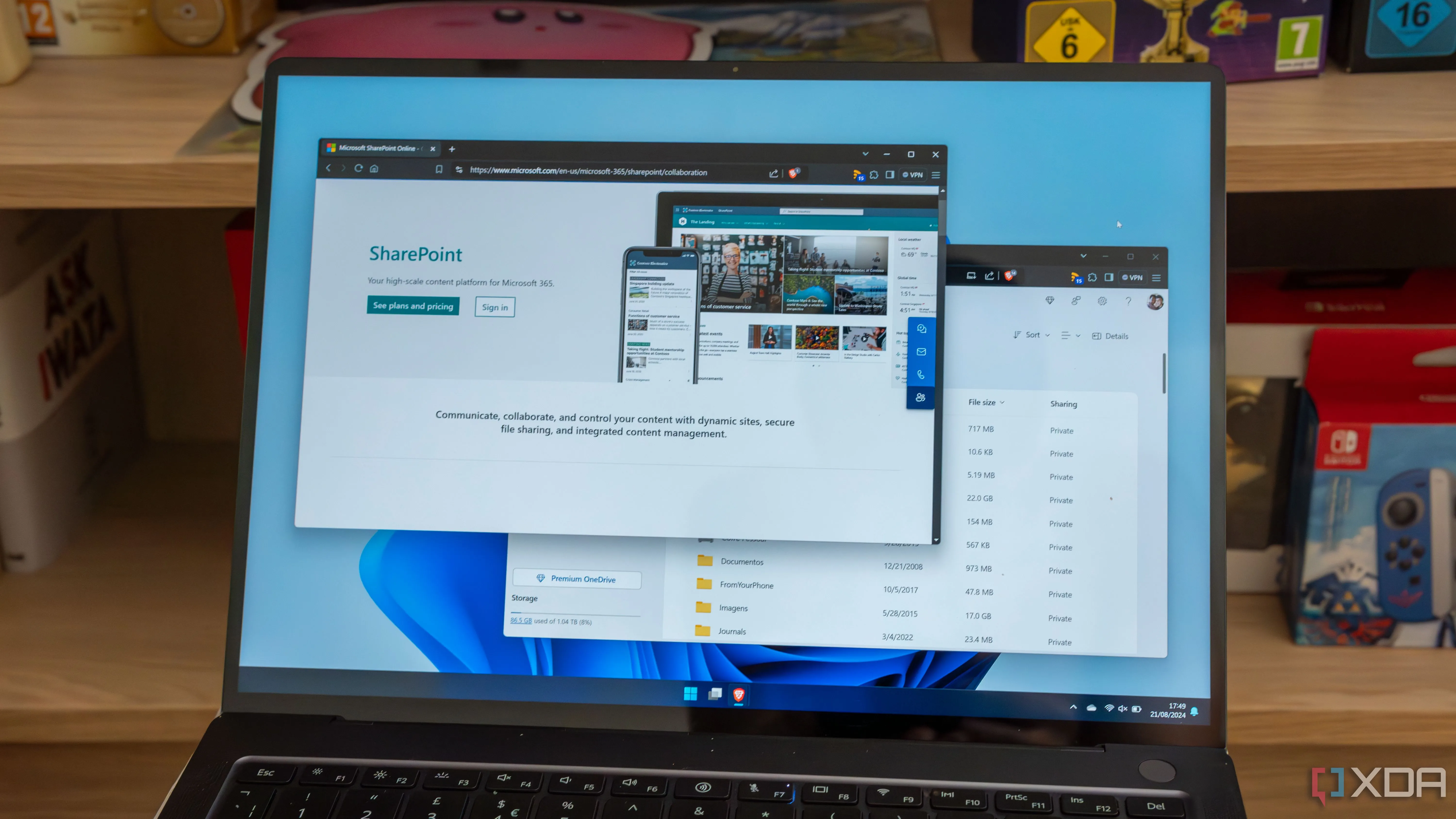 Laptop chạy Windows 11 hiển thị các tệp trong OneDrive và trang SharePoint