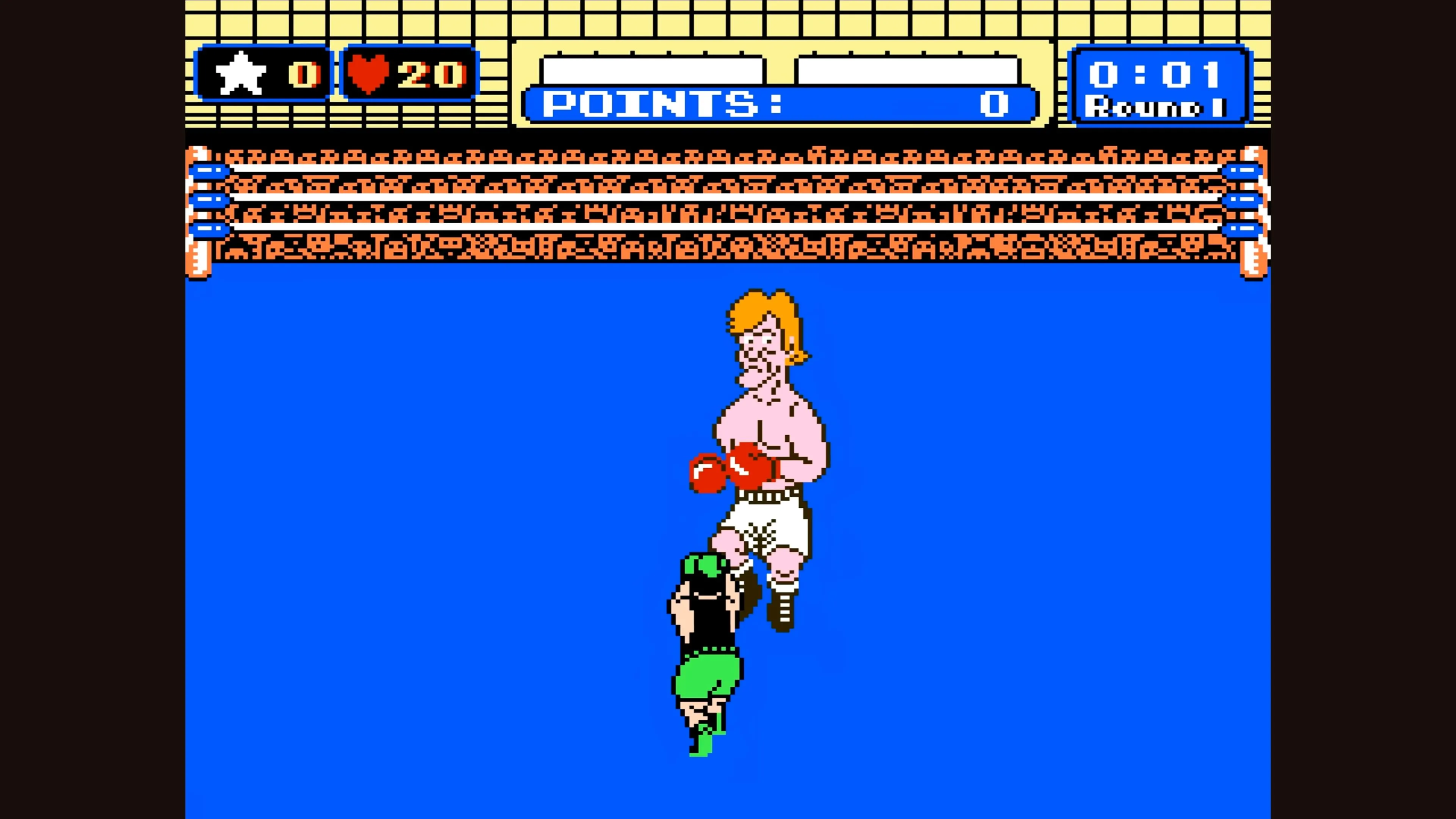 Little Mac đang chiến đấu với một đối thủ tóc vàng trong Punch-Out!!