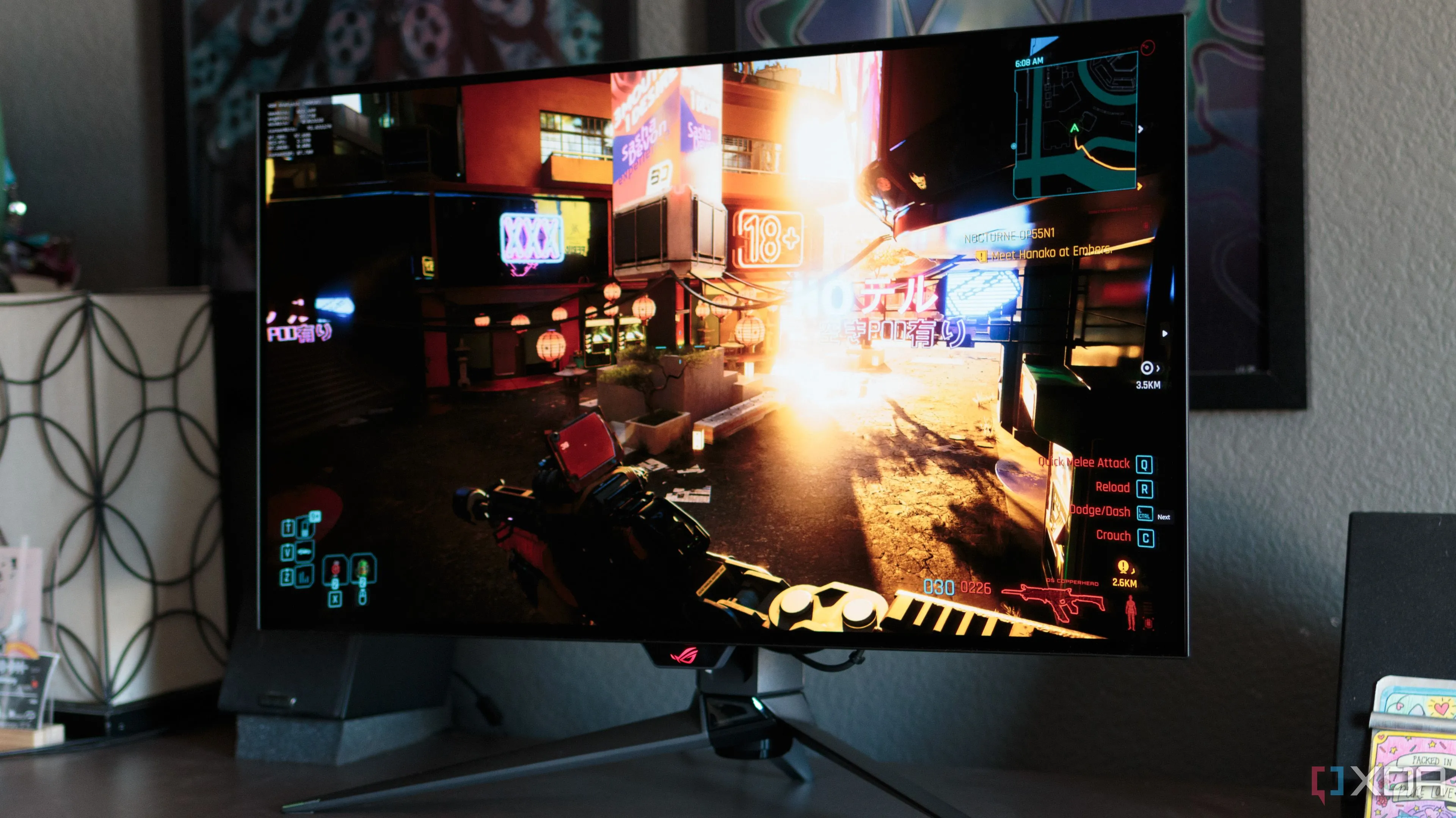 Màn hình ASUS ROG PG32UCDP hiển thị cảnh trong game Cyberpunk 2077, minh họa đồ họa ấn tượng của các tựa game hiện đại.
