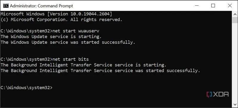 Màn hình Command Prompt với lệnh &quot;net start wuauserv&quot; và &quot;net start bits&quot; để khởi động lại dịch vụ cập nhật