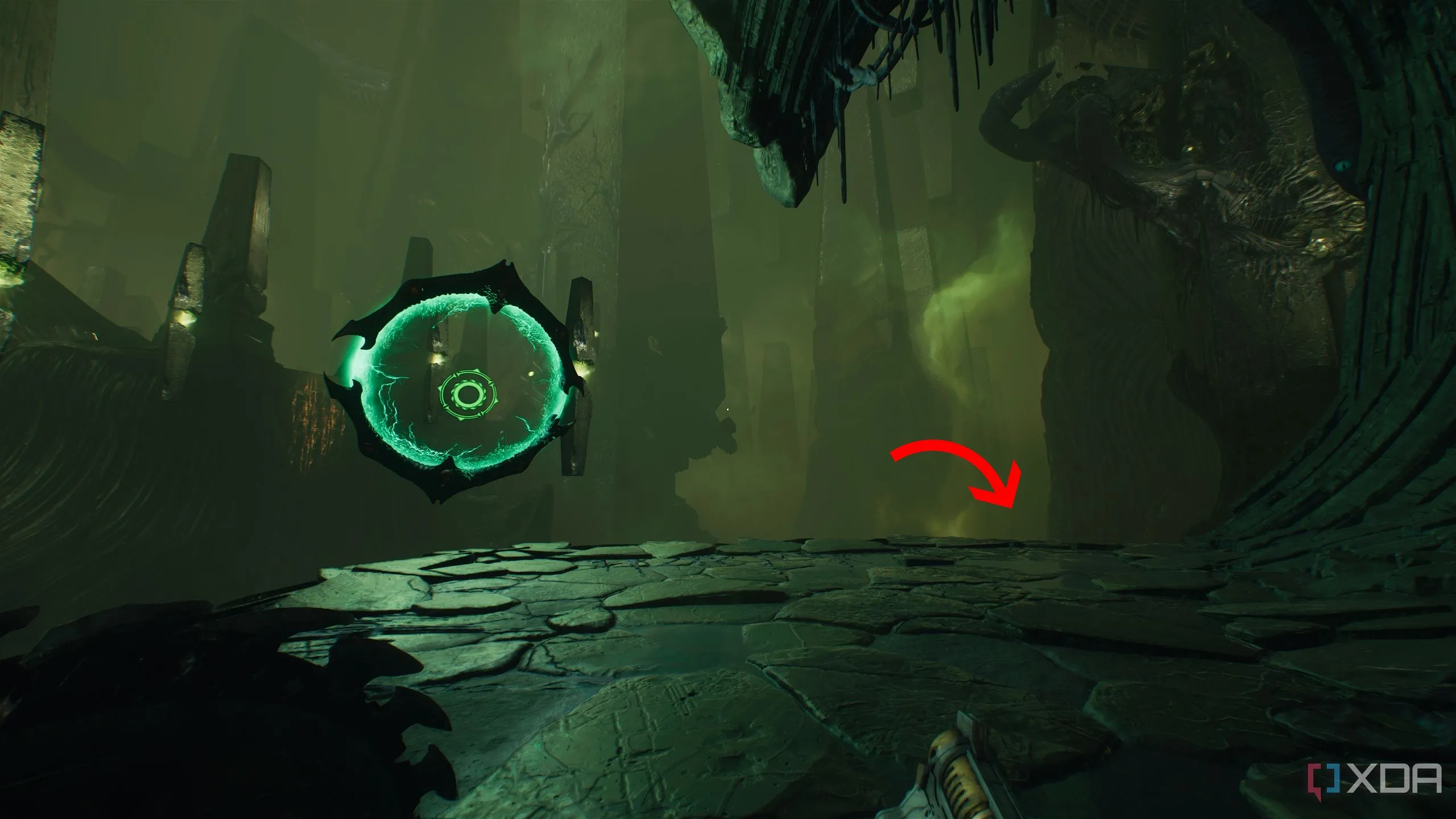 Mũi tên chỉ xuống bên phải cạnh một shield portal trong Chapter 15 của Doom: The Dark Ages.