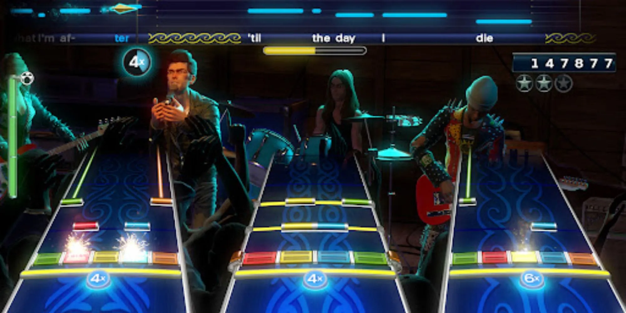 Người chơi tham gia ban nhạc ảo trong game Rock Band 4 cùng các nhạc cụ điều khiển