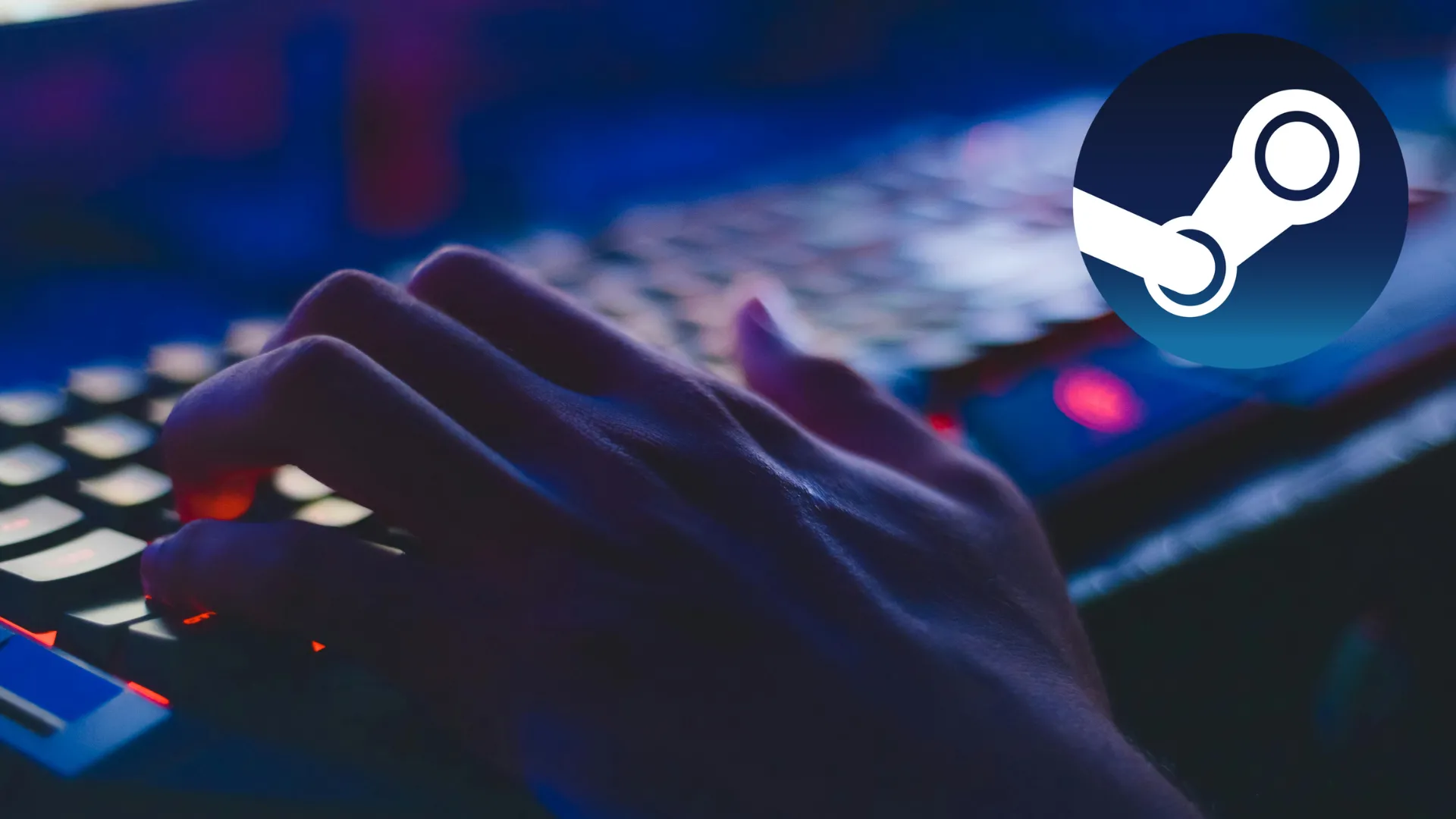 Người dùng đang gõ bàn phím với logo Steam hiển thị trên màn hình máy tính