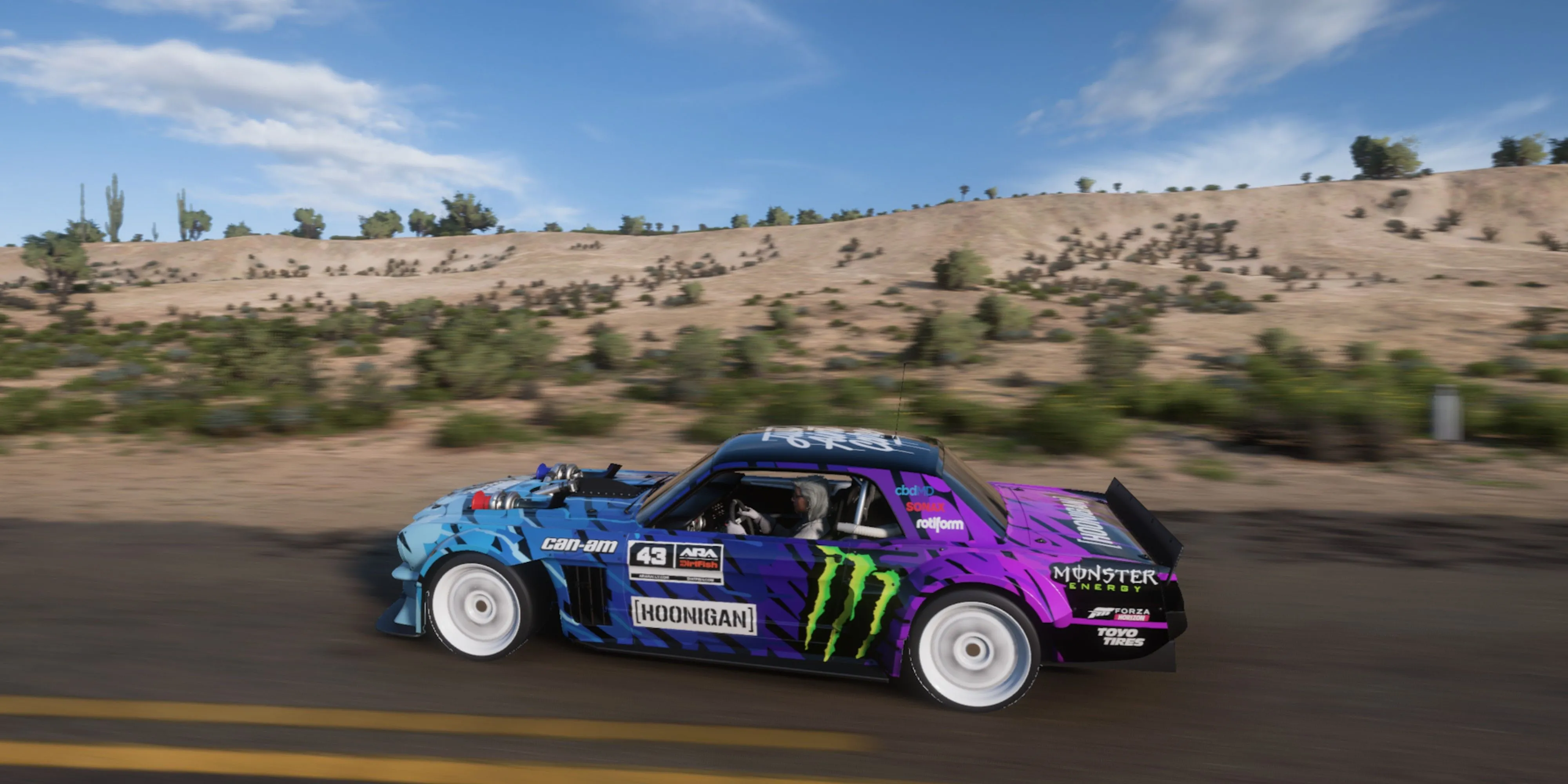 Xe Hoonigan Ford Hoonicorn Mustang v2 màu đen đang trượt trên đường trong Forza Horizon 5.
